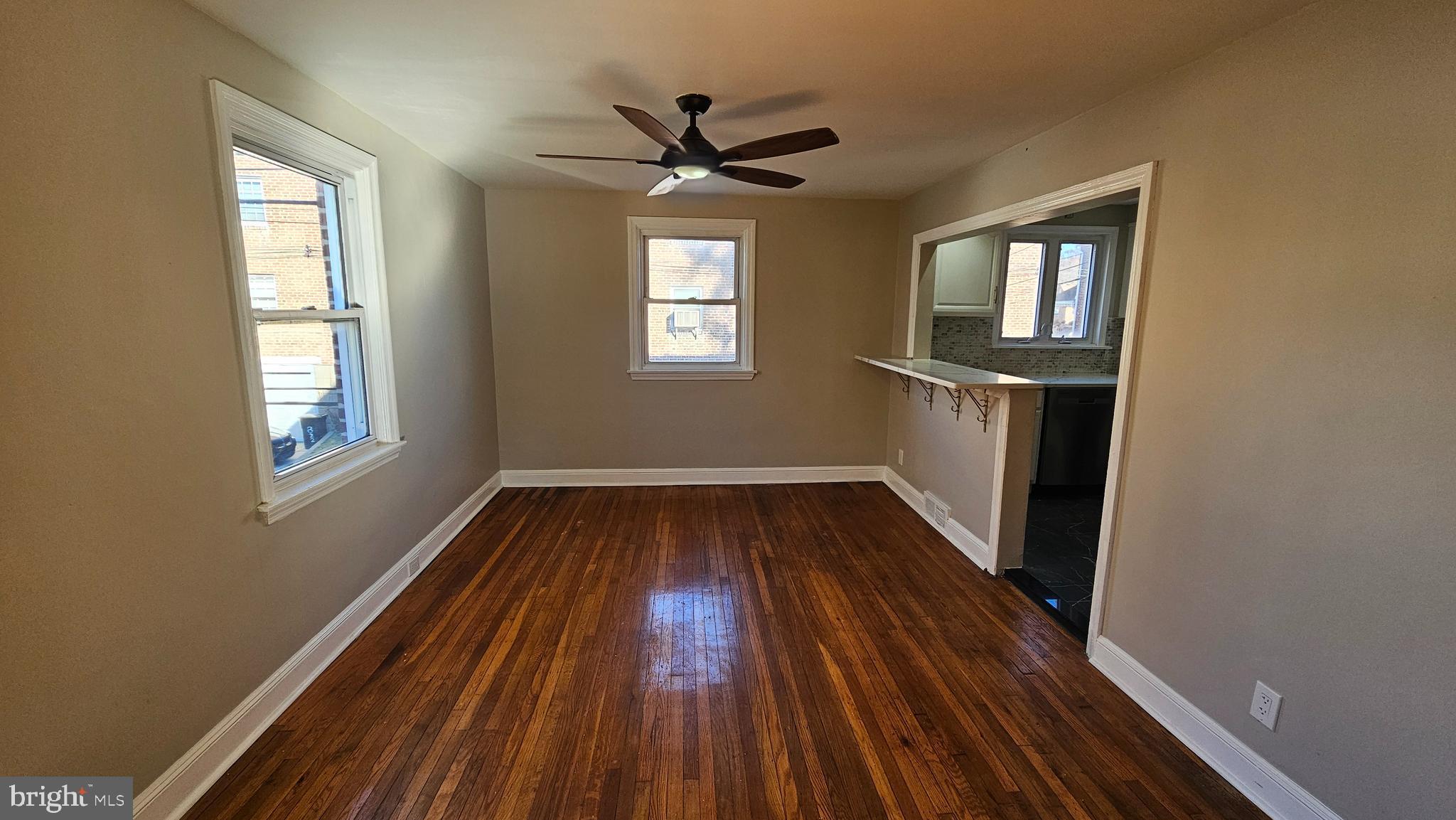 825 Laurel Road Lansdowne, PA 19050 - Photo 8 of 35 a view of empty room with wooden floor and fan