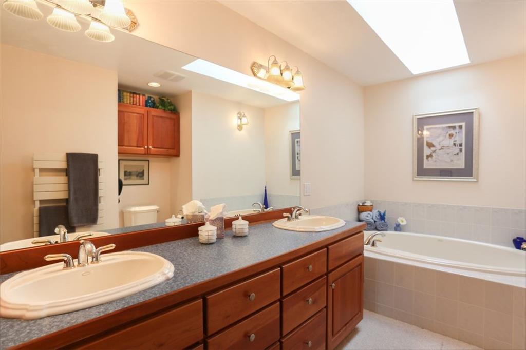 99 M Road Silverthorne, CO 80498 - Photo 11 of 33 a bathroom with a tub double sink and mirror
