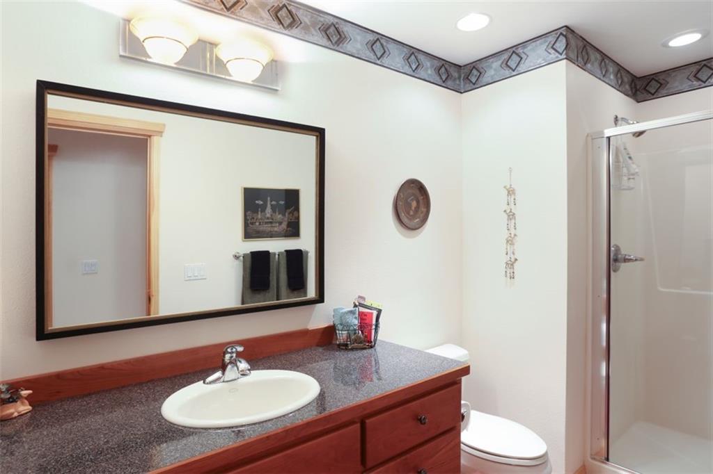 99 M Road Silverthorne, CO 80498 - Photo 13 of 33 a bathroom with a sink vanity mirror and toilet