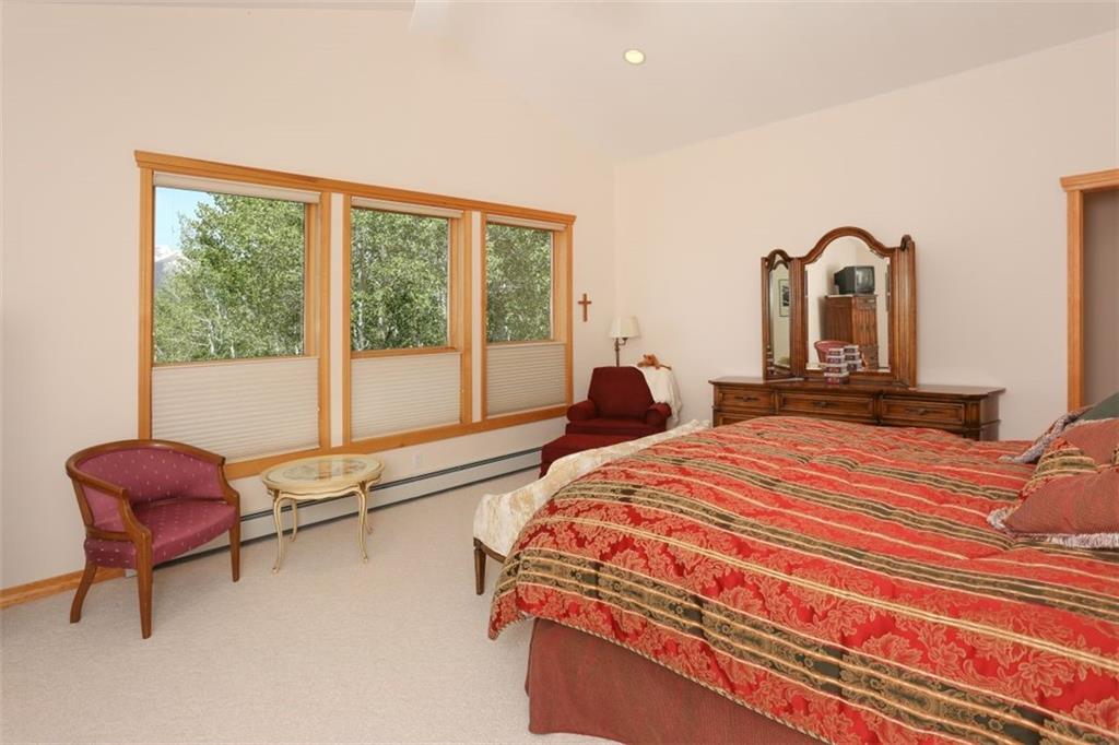 99 M Road Silverthorne, CO 80498 - Photo 15 of 33 a bedroom with a bed and a large window