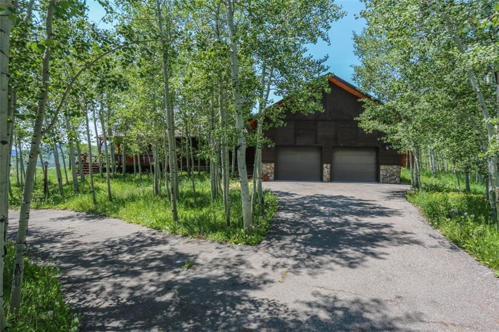 99 M Road Silverthorne, CO 80498 - Photo 28 of 33 a view of a house with backyard and a tree