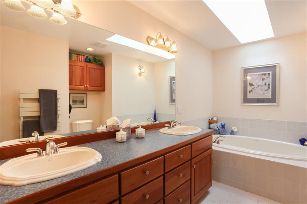 99 M Road Silverthorne, CO 80498 - Photo 31 of 33 a bathroom with a tub double sink and mirror