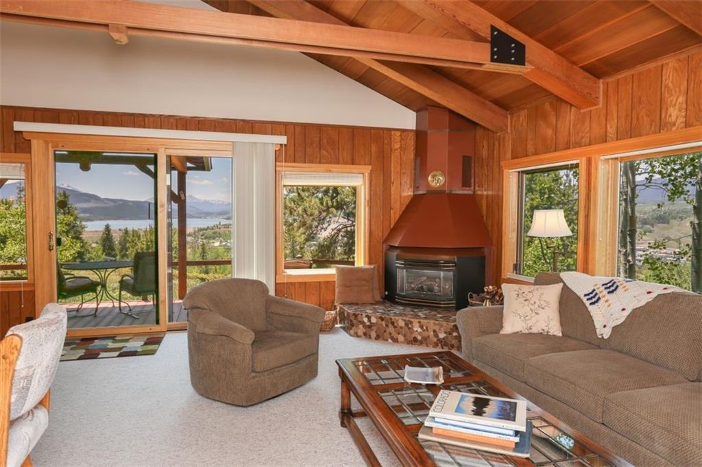 99 M Road Silverthorne, CO 80498 - Photo 6 of 33 a living room with furniture and a floor to ceiling window