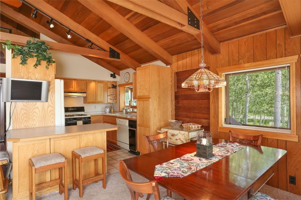 99 M Road Silverthorne, CO 80498 - Photo 8 of 33 a outdoor dining space with furniture and wooden floor