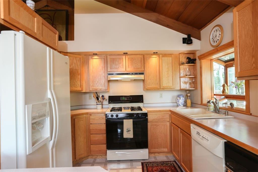 99 M Road Silverthorne, CO 80498 - Photo 9 of 33 a kitchen with stainless steel appliances granite countertop a stove a sink and a refrigerator