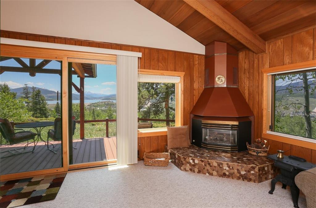 99 M Road Silverthorne, CO 80498 - Photo 10 of 33 a living room with furniture a flat screen tv and a fireplace