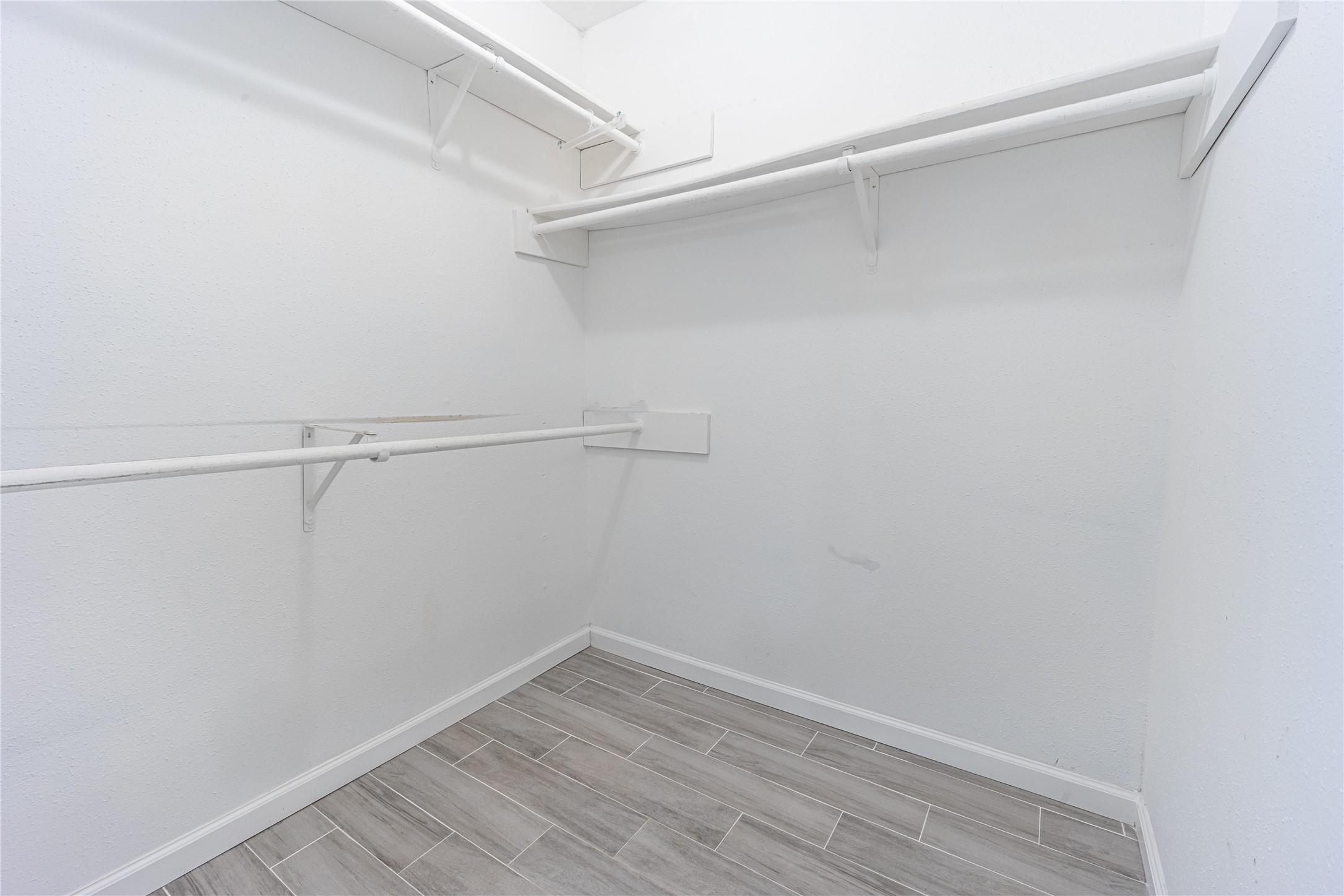 1010 Woodbridge Avenue Pearland, TX 77584 - Photo 7 of 14 a view of a room with racks on the wall