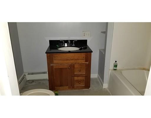 34 Manning Road Chelmsford, MA 01824 - Photo 18 of 30 a kitchen with a refrigerator and a stove