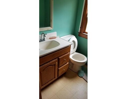 34 Manning Road Chelmsford, MA 01824 - Photo 21 of 30 a bathroom with a toilet sink and mirror