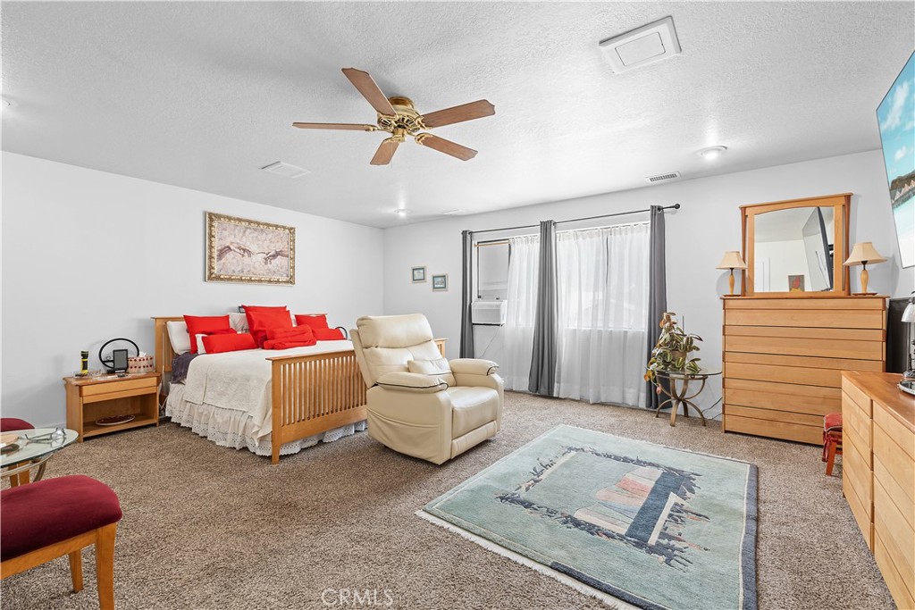 1876 Sparrow Road Wrightwood, CA 92397 - Photo 16 of 31 a bedroom with furniture and a window