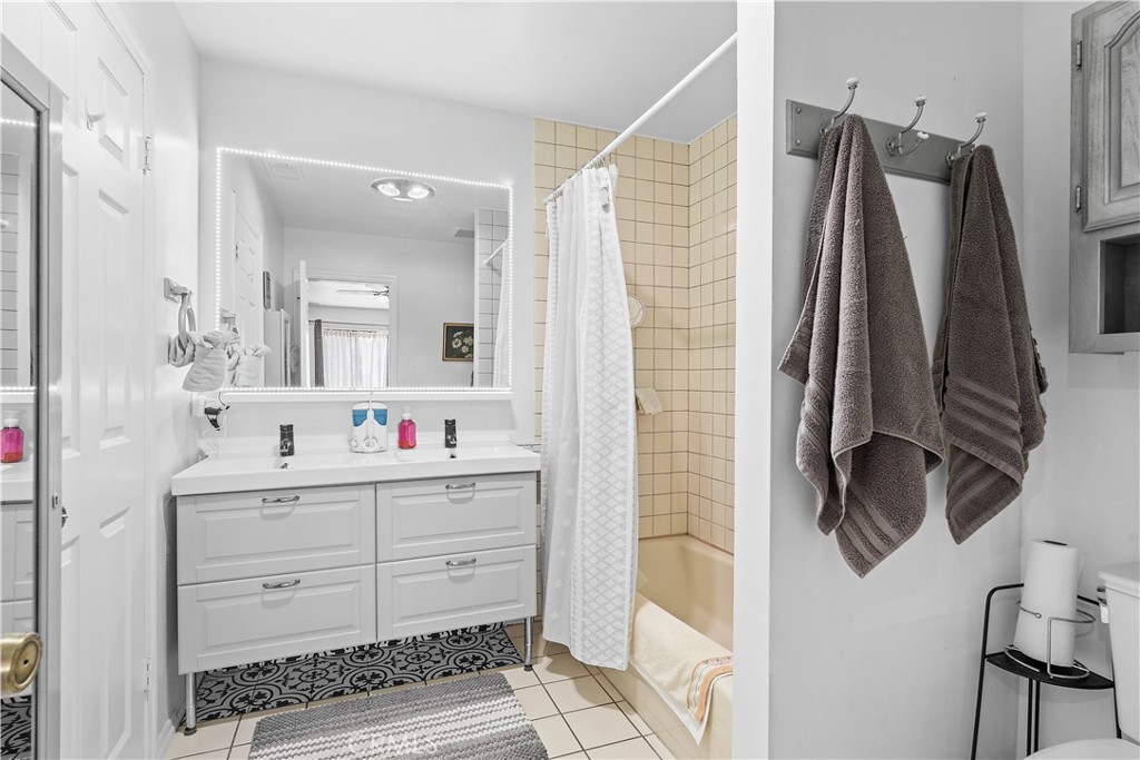 1876 Sparrow Road Wrightwood, CA 92397 - Photo 20 of 31 a bathroom with a double vanity sink and mirror