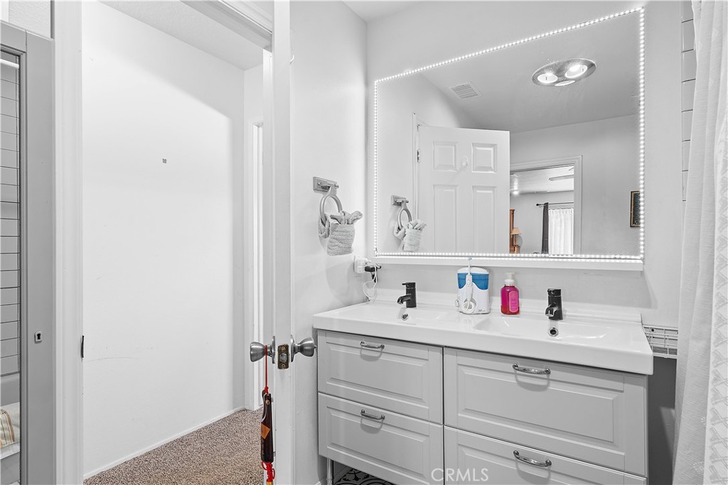 1876 Sparrow Road Wrightwood, CA 92397 - Photo 21 of 31 a bathroom with a sink and a mirror