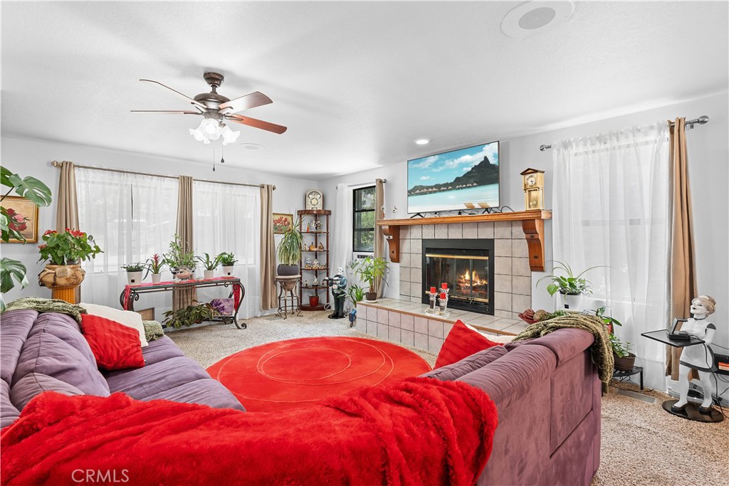 1876 Sparrow Road Wrightwood, CA 92397 - Photo 7 of 31 a living room with furniture and a fireplace