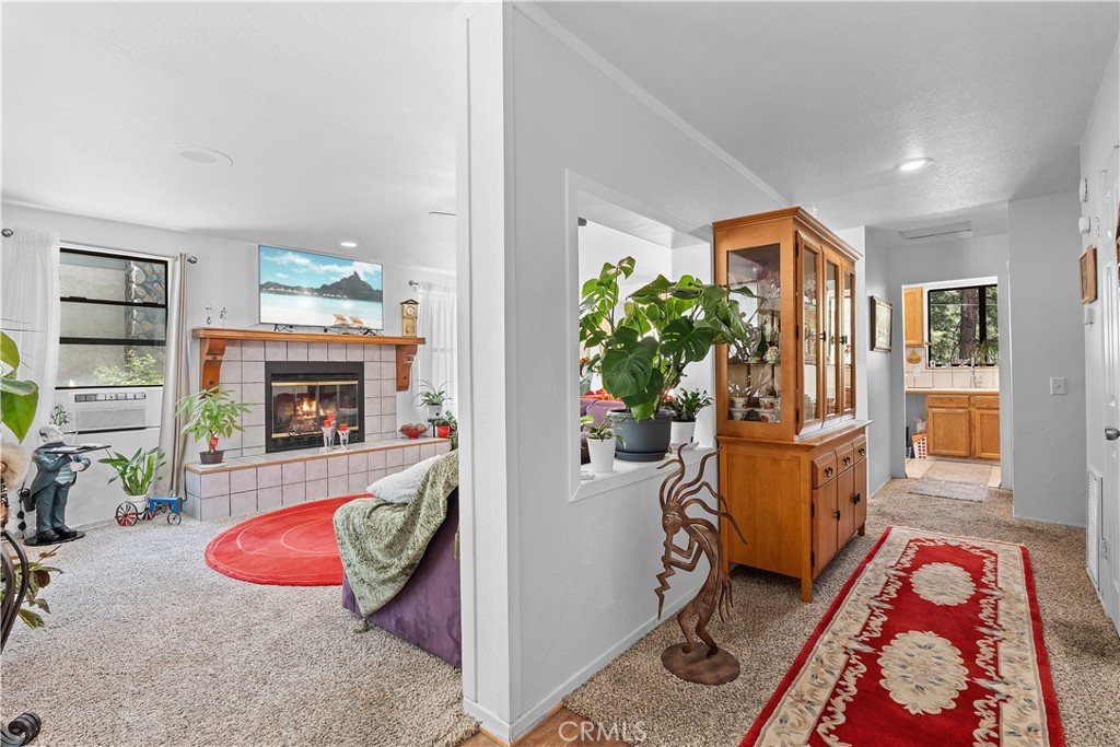 1876 Sparrow Road Wrightwood, CA 92397 - Photo 8 of 31 a bedroom with furniture and a fireplace