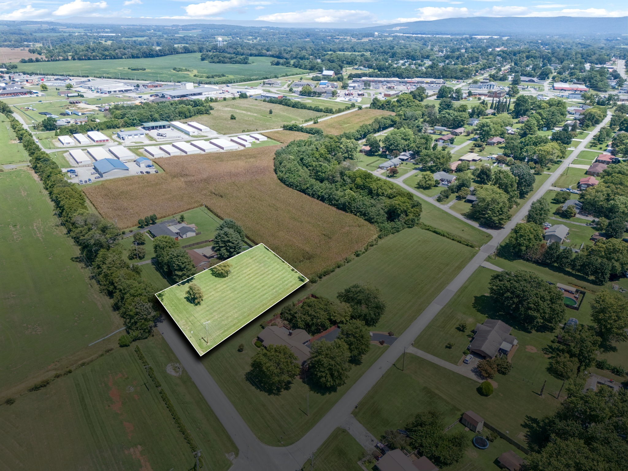 an aerial view of a houses with a yard