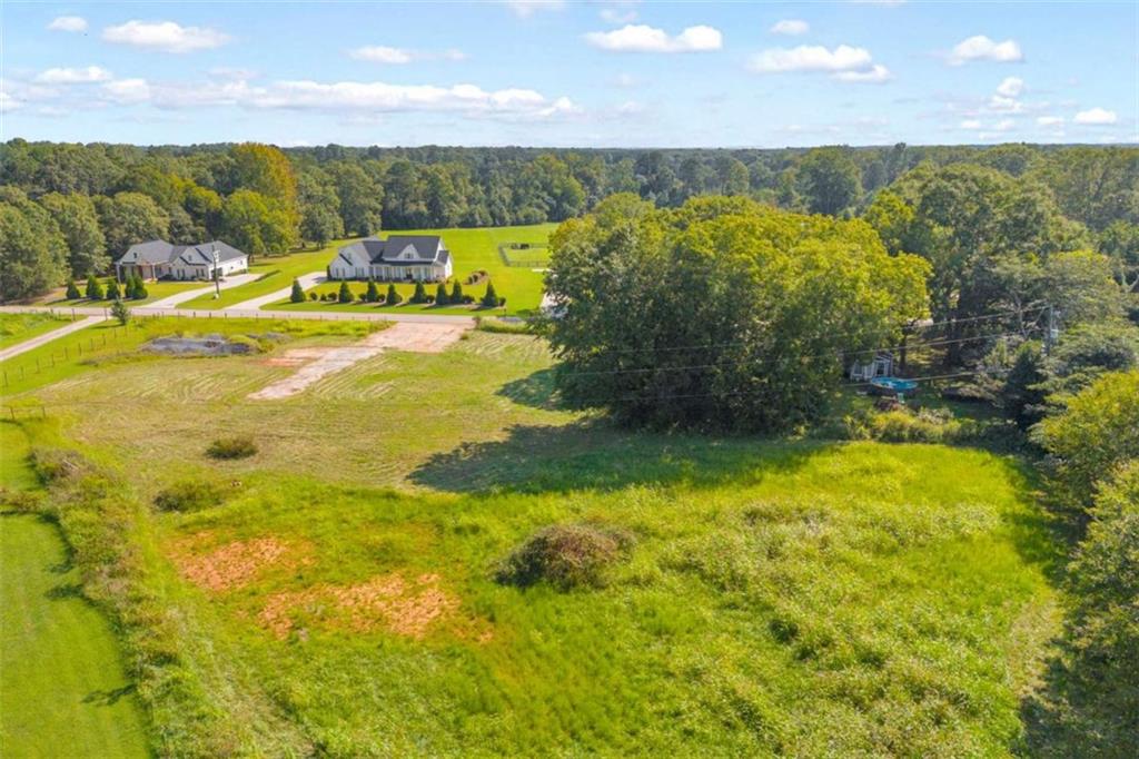 2720 John Stowe Road Monroe, GA 30656 - Photo 13 of 17 a view of a lake with lawn chairs