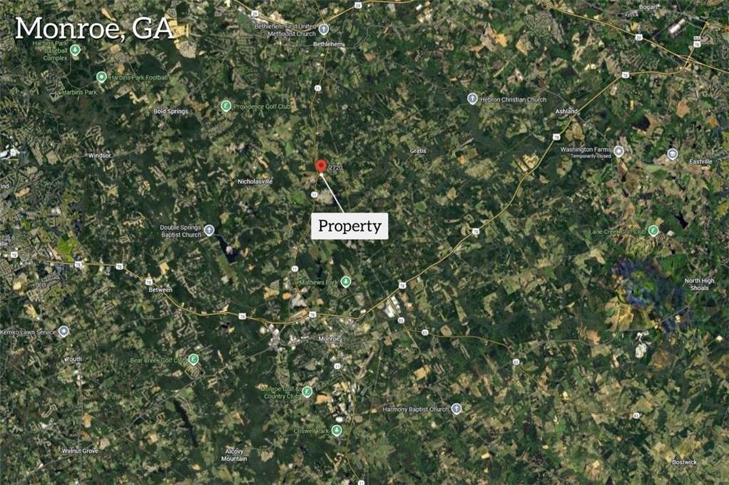 2720 John Stowe Road Monroe, GA 30656 - Photo 3 of 17 a sign that is sitting in front of a tree