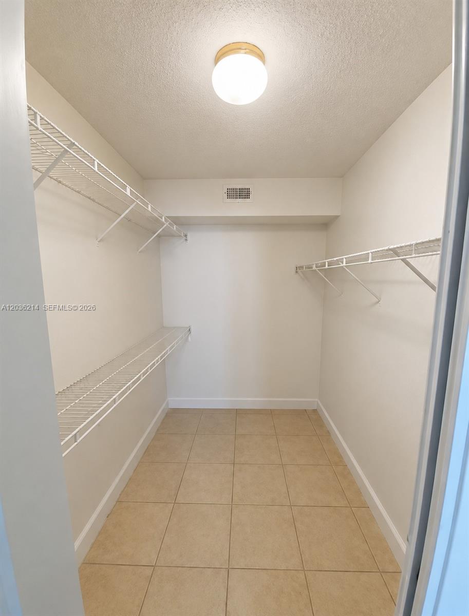 8741 Wiles Road, Unit 204 Coral Springs, FL 33067 - Photo 10 of 16 a view of a room with racks on the wall
