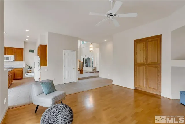 a view of a room with a hallway and a window