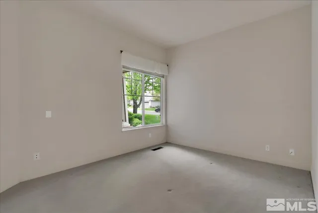 a bathroom with a granite countertop sink mirror and double