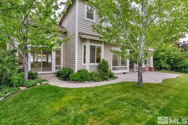 a view of a backyard of the house