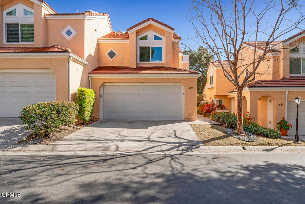 6301 Honolulu Avenue, Unit 47 Tujunga, CA 91042 - Photo 1 of 40 a front view of a house with a yard