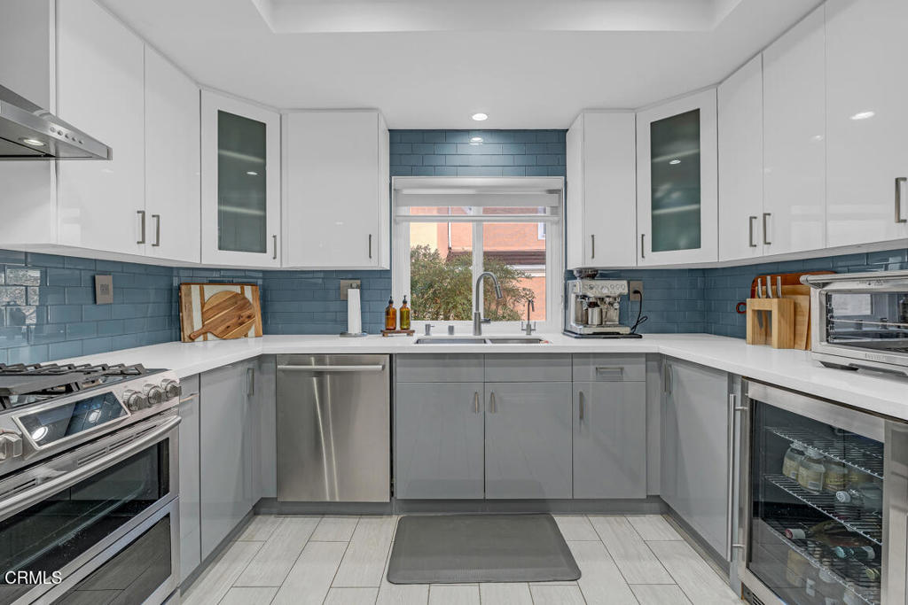 6301 Honolulu Avenue, Unit 47 Tujunga, CA 91042 - Photo 13 of 40 a kitchen with a sink stove and cabinets