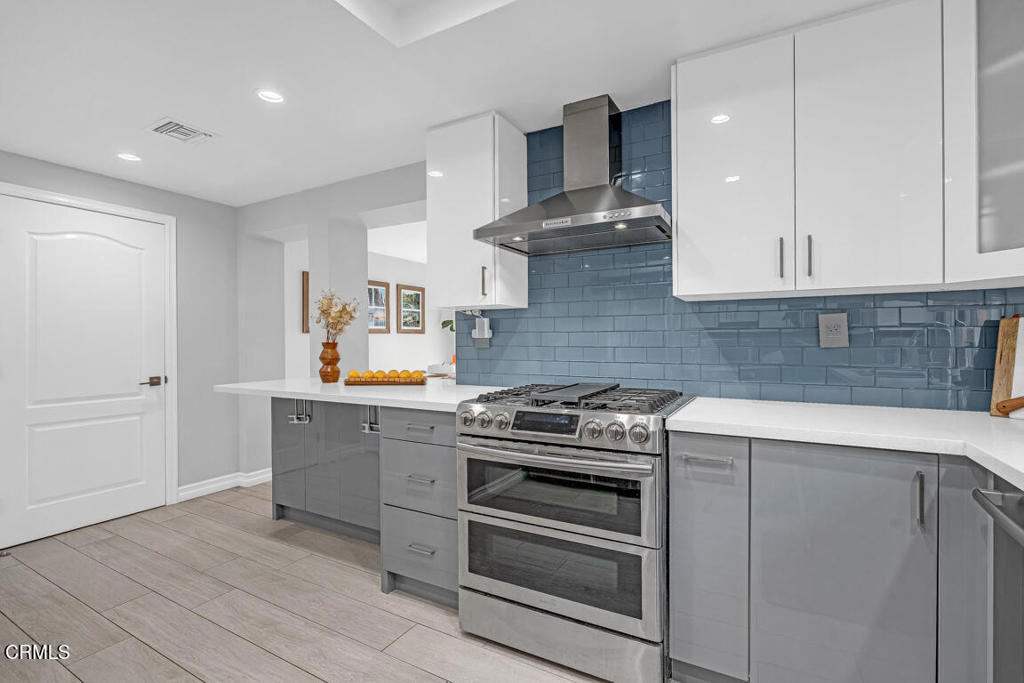6301 Honolulu Avenue, Unit 47 Tujunga, CA 91042 - Photo 16 of 40 a kitchen with a stove and a sink