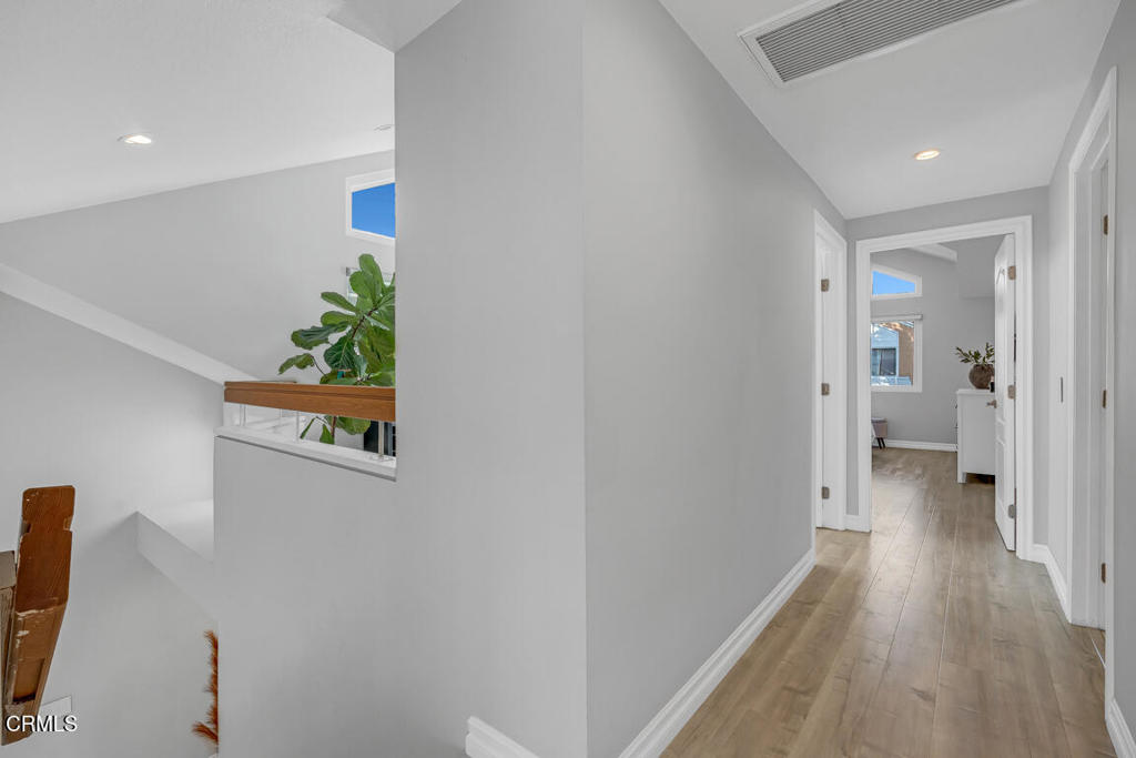 6301 Honolulu Avenue, Unit 47 Tujunga, CA 91042 - Photo 18 of 40 a view of a hallway with wooden floor