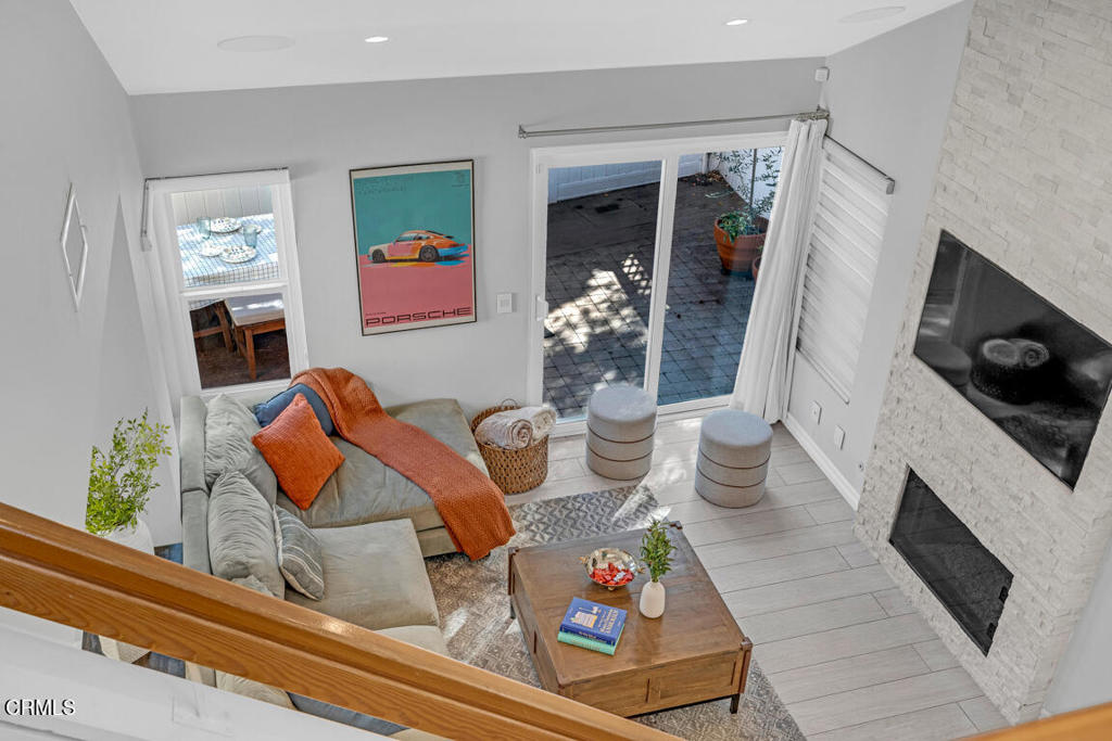 6301 Honolulu Avenue, Unit 47 Tujunga, CA 91042 - Photo 23 of 40 a living room with furniture and a fireplace