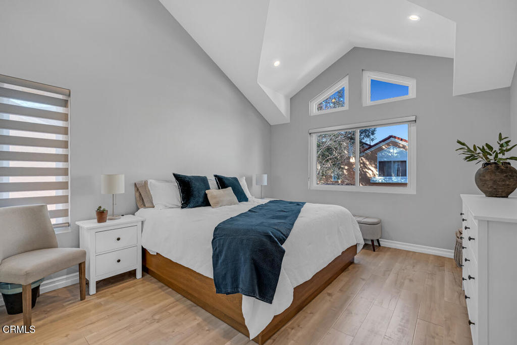 6301 Honolulu Avenue, Unit 47 Tujunga, CA 91042 - Photo 24 of 40 a bedroom with a bed and a painting on the wall