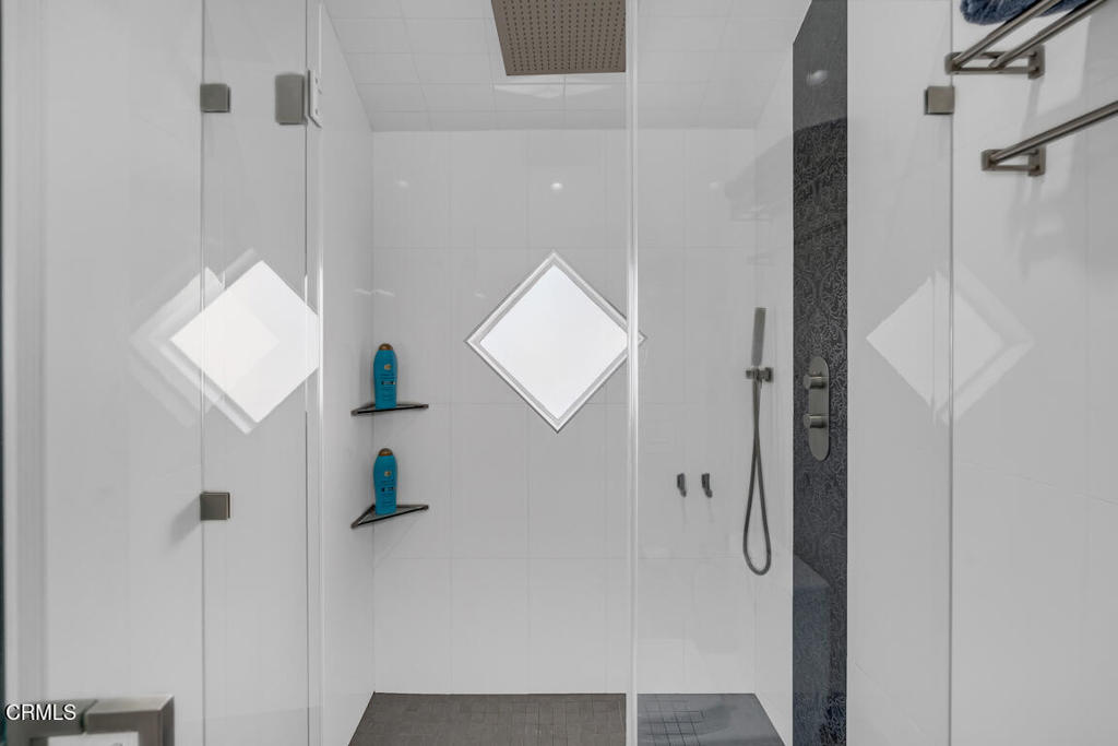 6301 Honolulu Avenue, Unit 47 Tujunga, CA 91042 - Photo 27 of 40 a bathroom with a shower and a vanity