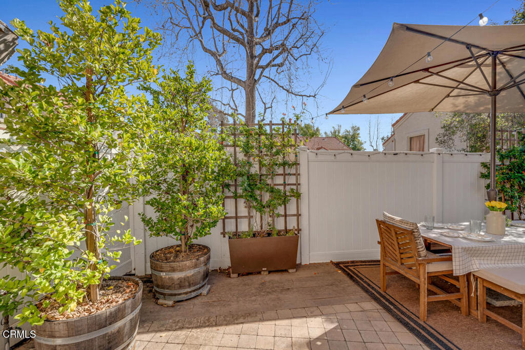 6301 Honolulu Avenue, Unit 47 Tujunga, CA 91042 - Photo 28 of 40 a patio with a table and chairs and potted plants