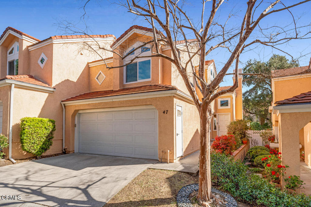 6301 Honolulu Avenue, Unit 47 Tujunga, CA 91042 - Photo 3 of 40 a front view of a house with garden