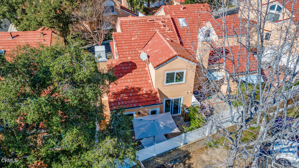 6301 Honolulu Avenue, Unit 47 Tujunga, CA 91042 - Photo 34 of 40 an aerial view of a house with a yard and potted plants