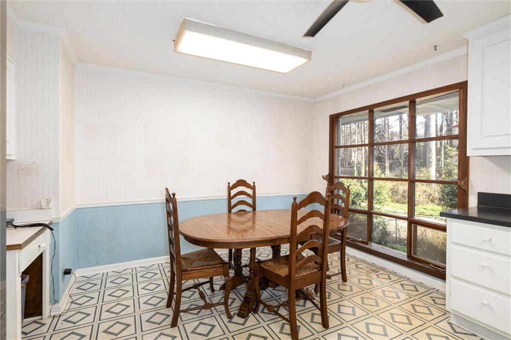 5416 Pheasant Run Smoke Rise, GA 30087 - Photo 14 of 47 a view of a dining room that has a table and chairs
