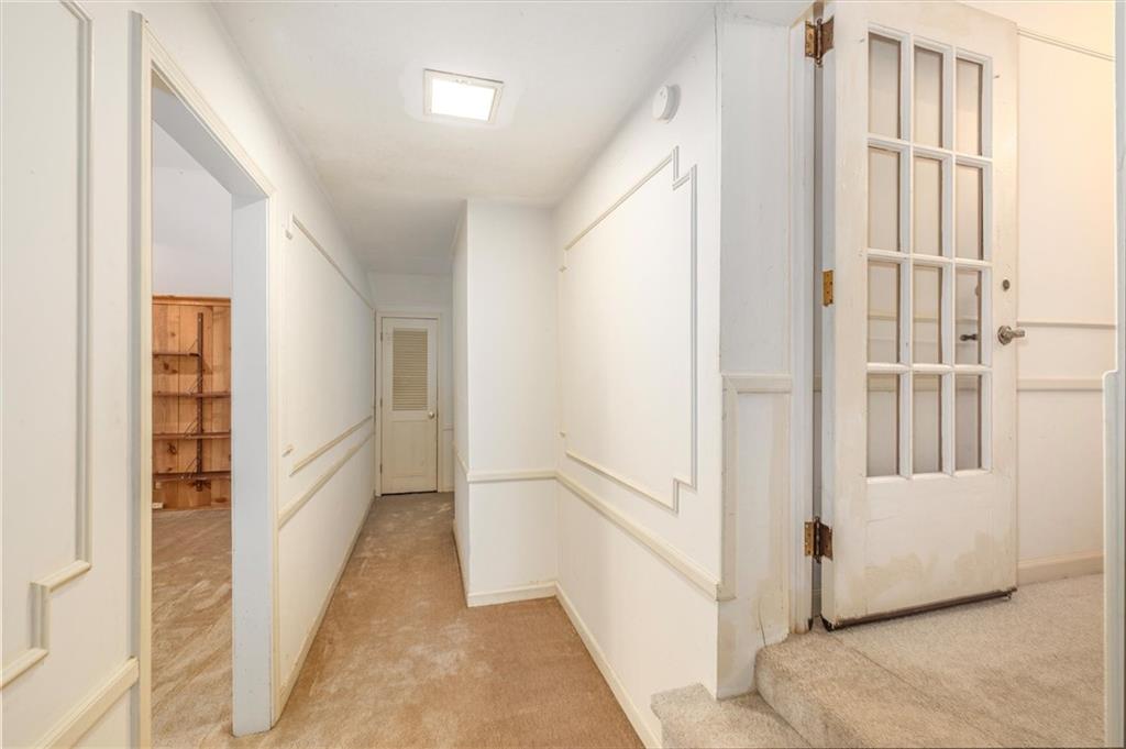 5416 Pheasant Run Smoke Rise, GA 30087 - Photo 26 of 47 a view of a hallway with a white walls and stairs