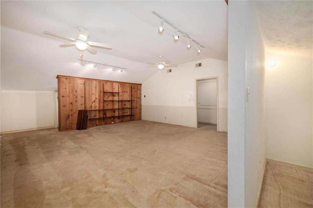 5416 Pheasant Run Smoke Rise, GA 30087 - Photo 28 of 47 en empty room with closet and a ceiling fan