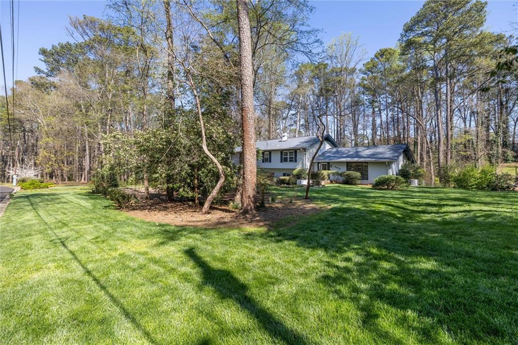 5416 Pheasant Run Smoke Rise, GA 30087 - Photo 3 of 47 a view of a house with a yard porch and sitting area