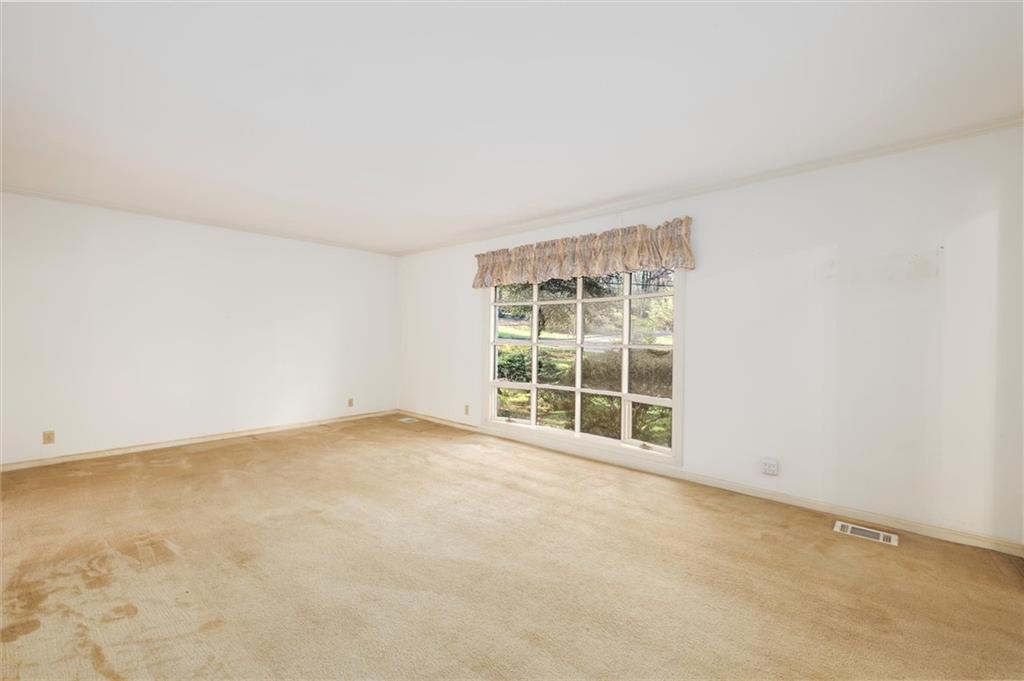 5416 Pheasant Run Smoke Rise, GA 30087 - Photo 9 of 47 an empty room with a window