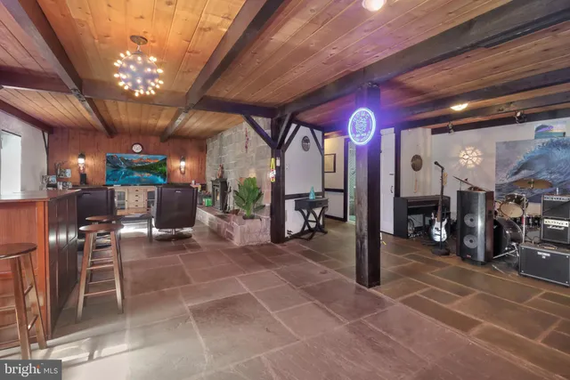 a house with green field in front of it