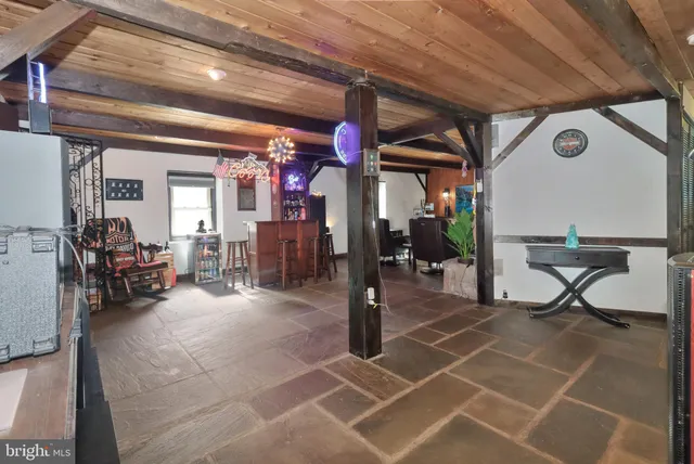 a view of house with backyard outdoor seating and green space