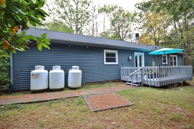 a view of a deck with a table and a chairs