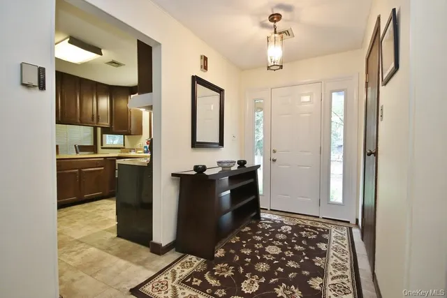 a kitchen with granite countertop a refrigerator and a stove