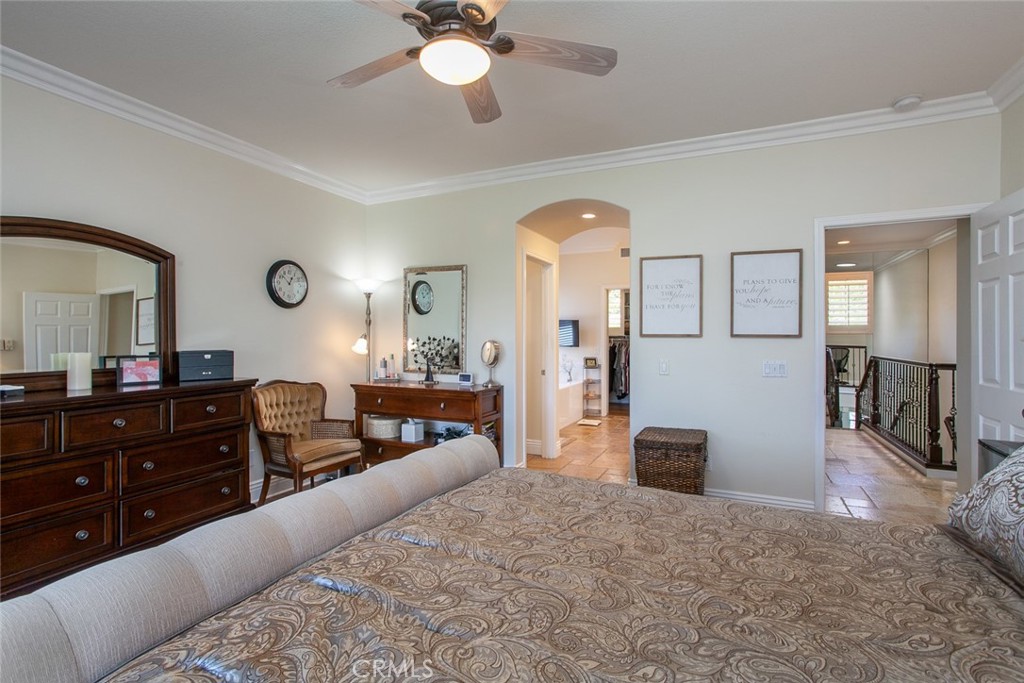 26211 Reade Place Stevenson Ranch, CA 91381 - Photo 25 of 42 a bedroom with a bed and a dresser