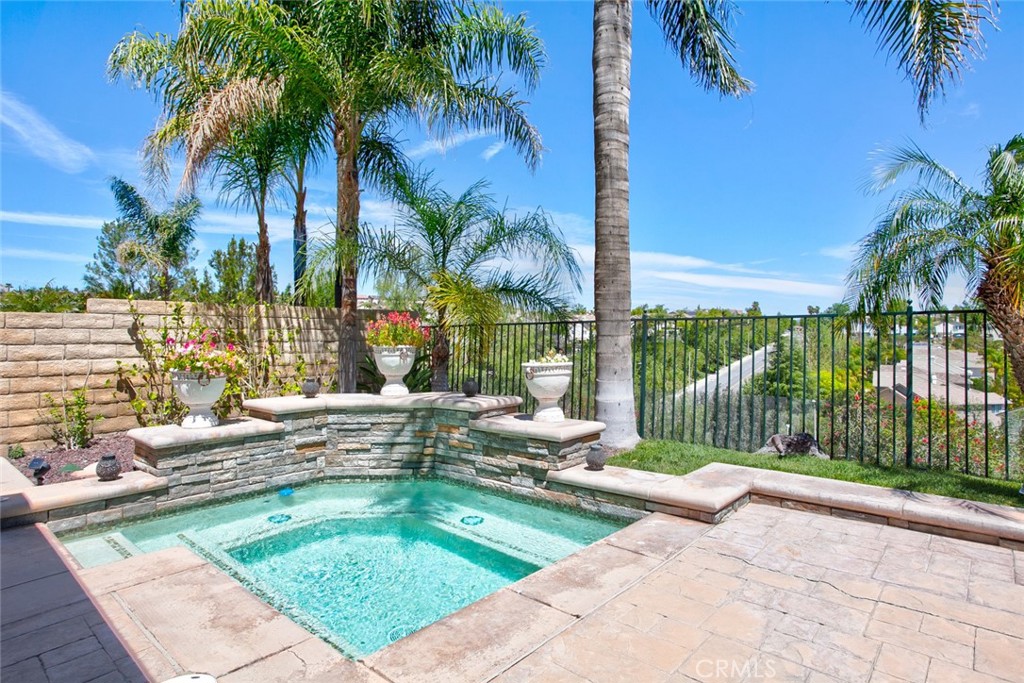 26211 Reade Place Stevenson Ranch, CA 91381 - Photo 28 of 42 a view of swimming pool with outdoor seating and plants