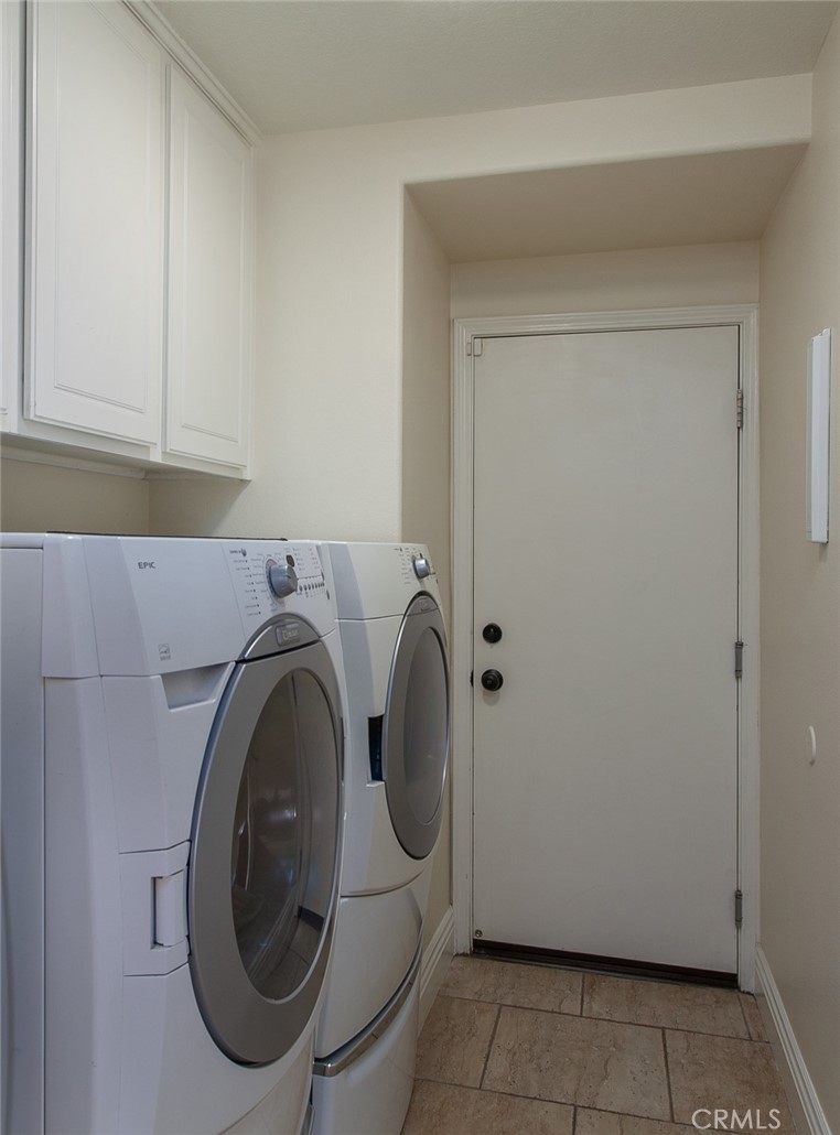 26211 Reade Place Stevenson Ranch, CA 91381 - Photo 31 of 42 a utility room with dryer and washer
