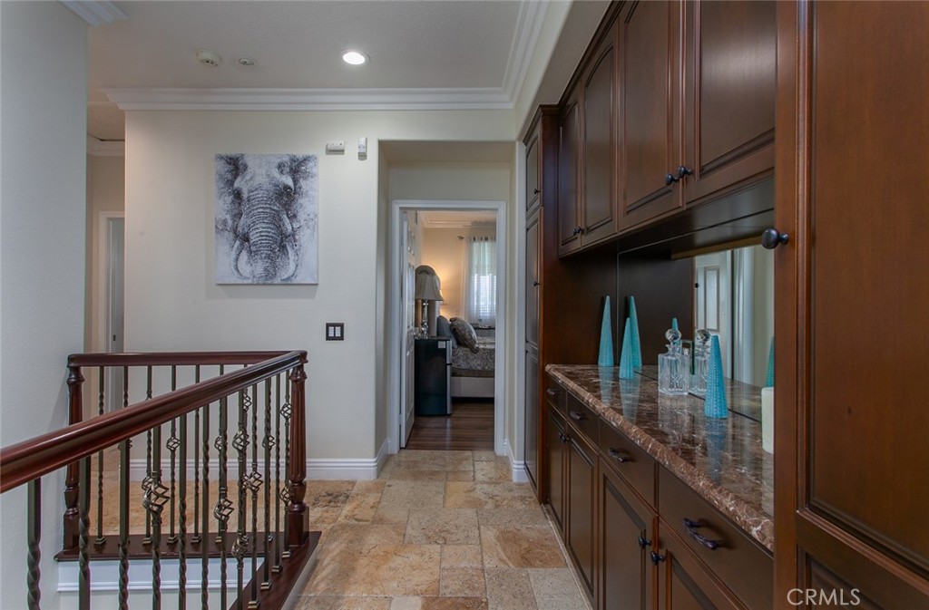26211 Reade Place Stevenson Ranch, CA 91381 - Photo 38 of 42 a hallway with two large mirror and a sink