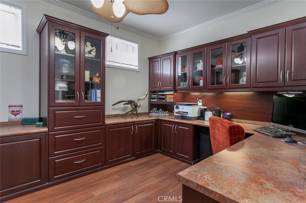 26211 Reade Place Stevenson Ranch, CA 91381 - Photo 42 of 42 a kitchen with a refrigerator and wooden cabinets