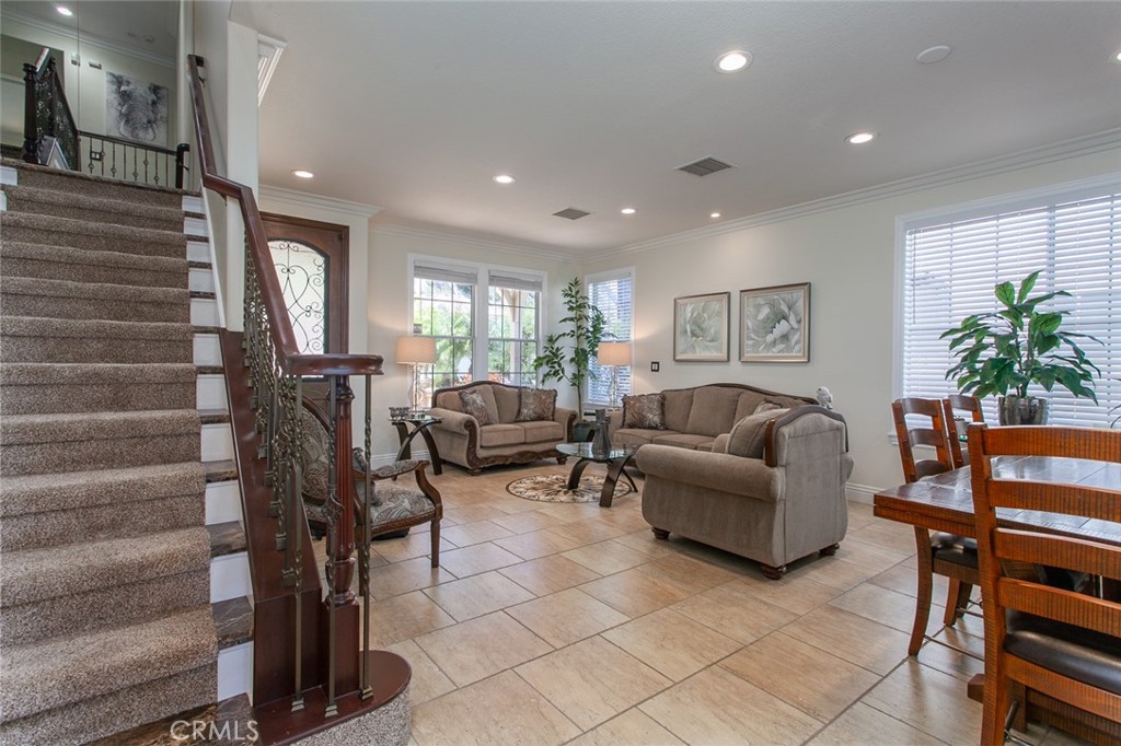 26211 Reade Place Stevenson Ranch, CA 91381 - Photo 8 of 42 a living room with furniture and a potted plant